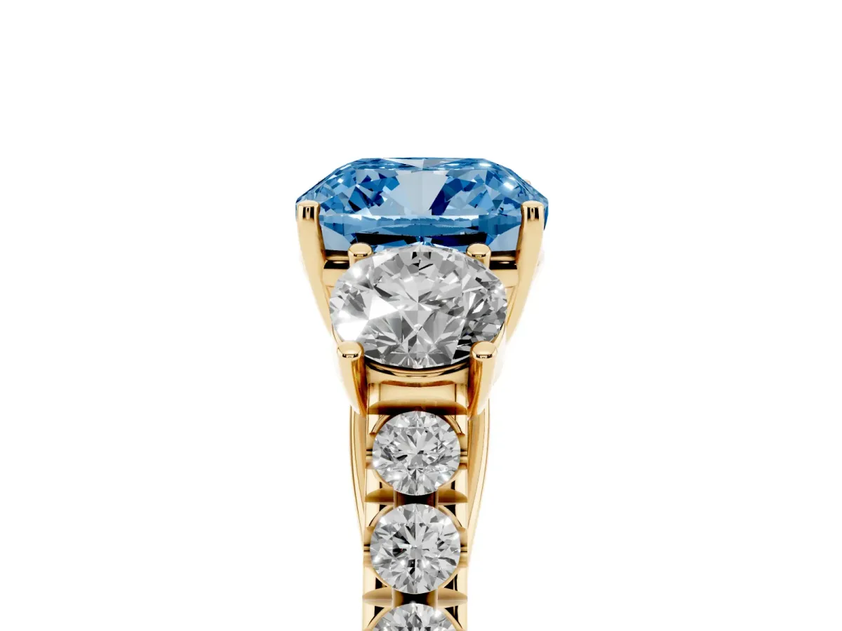 Fancy Blue Cushion Cut Cut Diamond Three-Stone Ring with Round Side Stones and Pavé Band Yellow gold