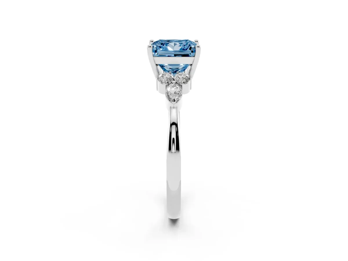 Fancy Blue Princess Cut Brilliant Diamond Solitaire Ring with Pear Side Stones and Four-Prong Setting Silver