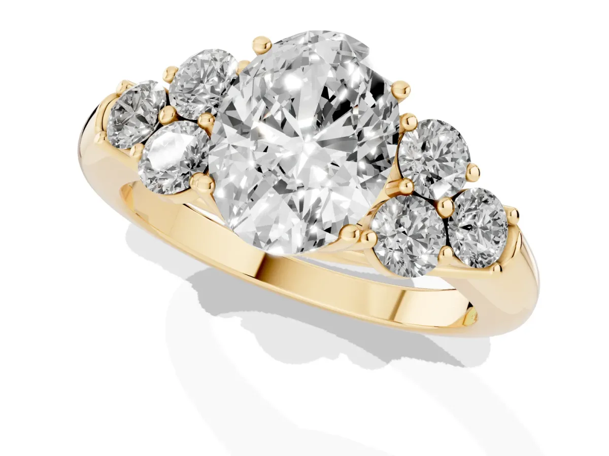 Oval Cut Cut Diamond Cluster Ring with Round Accent Stones and Prong Setting on a Classic Band Yellow gold