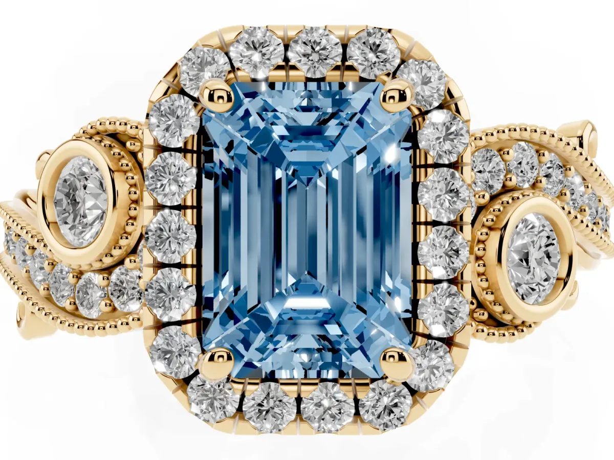 Fancy Blue Emerald Cut Diamond Halo Ring with Milgrain Pavé Band and Four-Prong Setting Yellow gold