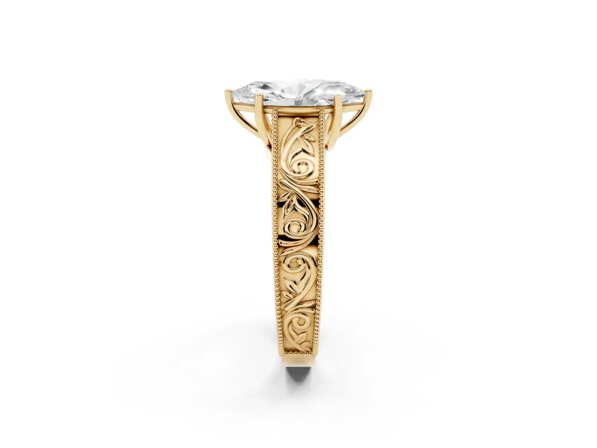 Marquise Cut Diamond Solitaire Ring with Engraved Band and Four-Prong Setting Yellow gold