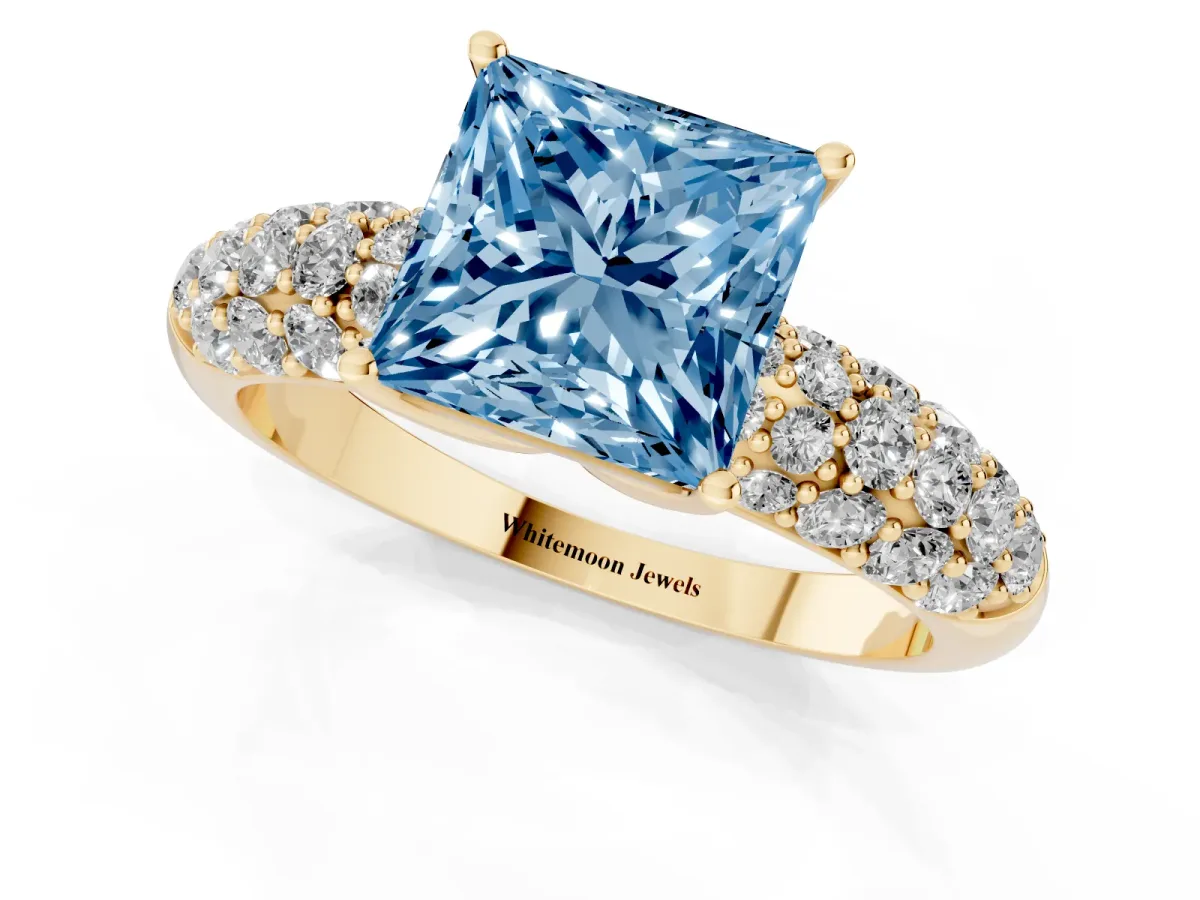 Fancy Blue Princess Cut Diamond Pavé Band Solitaire Ring with Four-Prong Setting Yellow gold