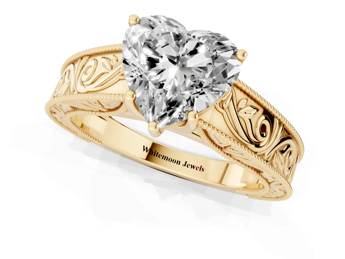 Heart Cut Diamond Solitaire Ring with Engraved Band and Four-Prong Setting Yellow gold