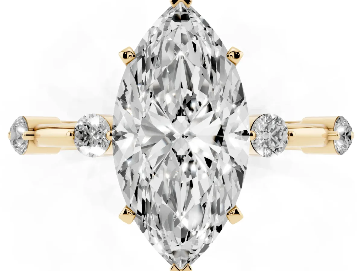 Marquise Cut Solitaire Diamond Ring with Bezel Set Side Stones and Prong Setting Yellow gold