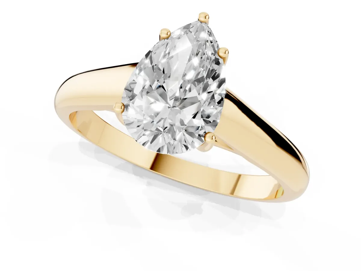 Pear Cut Solitaire Engagement Ring with Tapered Band and Four-Prong Setting Yellow gold