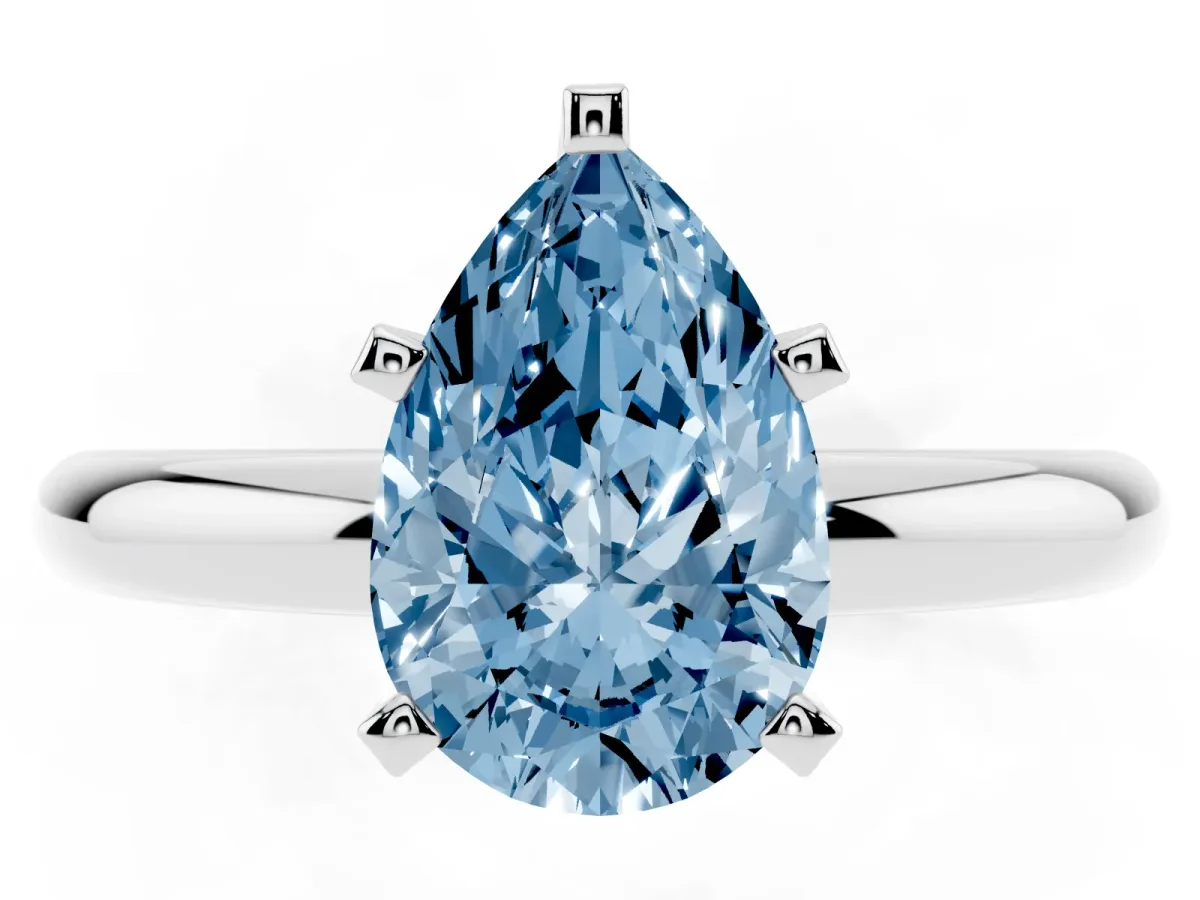 Fancy Blue Pear Cut Diamond Solitaire Engagement Ring with Round Band and Four-Prong Setting Silver