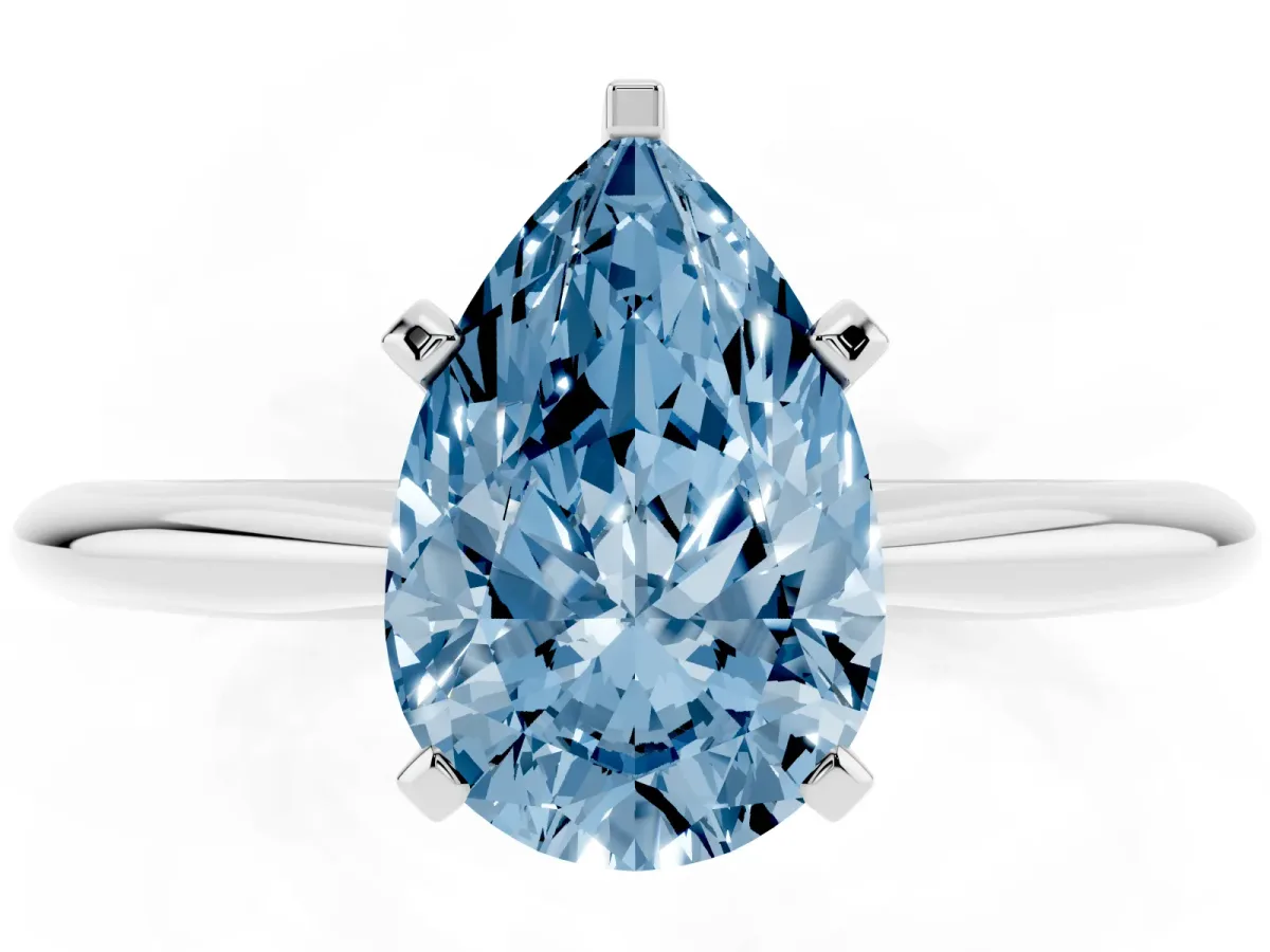 Fancy Blue Pear Cut Cut Solitaire Ring with Four-Prong Setting on a Classic Band Silver