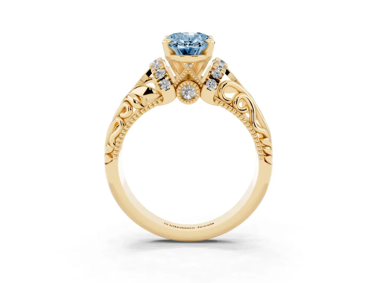 Fancy Blue Oval Cut Solitaire Filigree Engagement Ring with Halo and Prong Setting Yellow gold