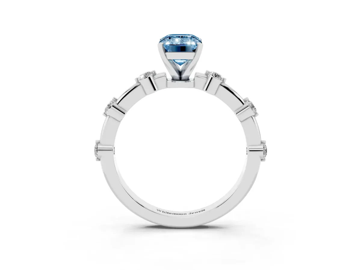 Fancy Blue Emerald Cut Solitaire Diamond Ring with Bezel Set Side Stones and Prong Setting Silver