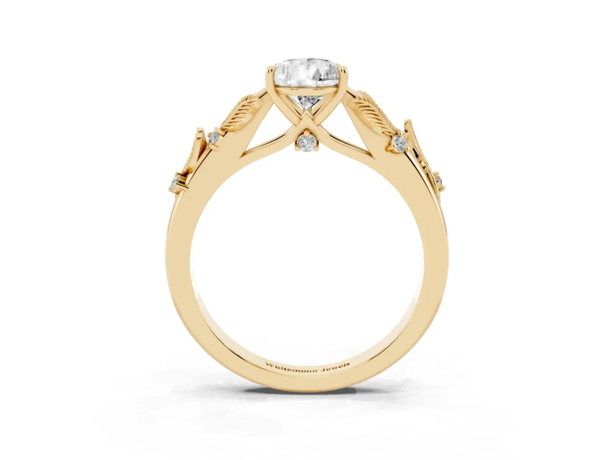 Pear Cut Diamond Solitaire Ring with Leaf Motif Band and Four-Prong Setting Yellow gold