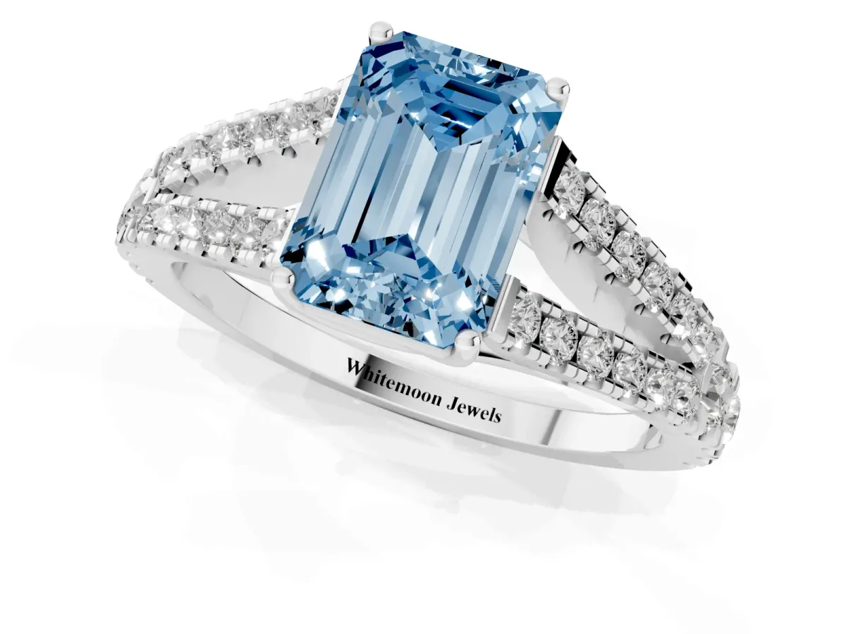 Fancy Blue Emerald Cut Diamond Split Shank Pavé Engagement Ring with Four-Prong Setting Silver