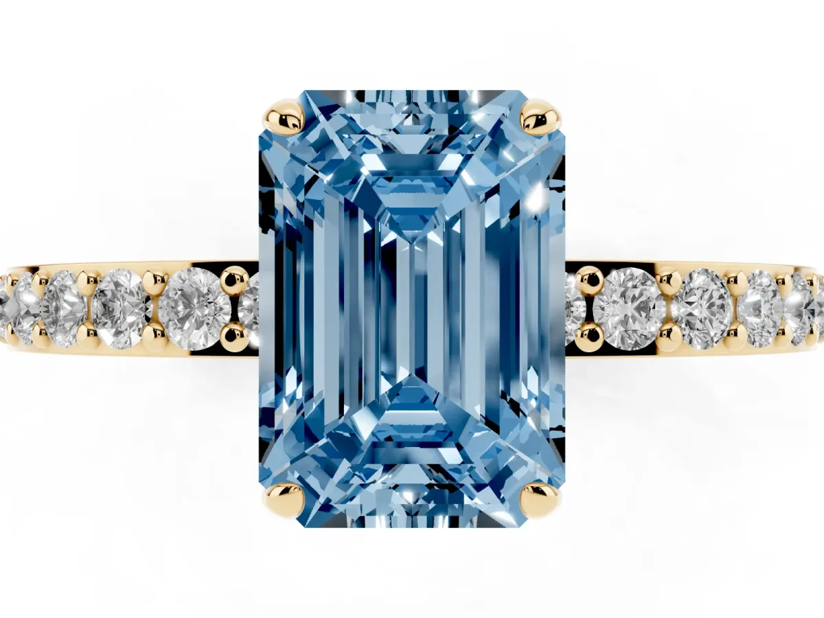Fancy Blue Emerald Cut Diamond Pavé Engagement Ring with Round Accents and Prong Setting Yellow gold