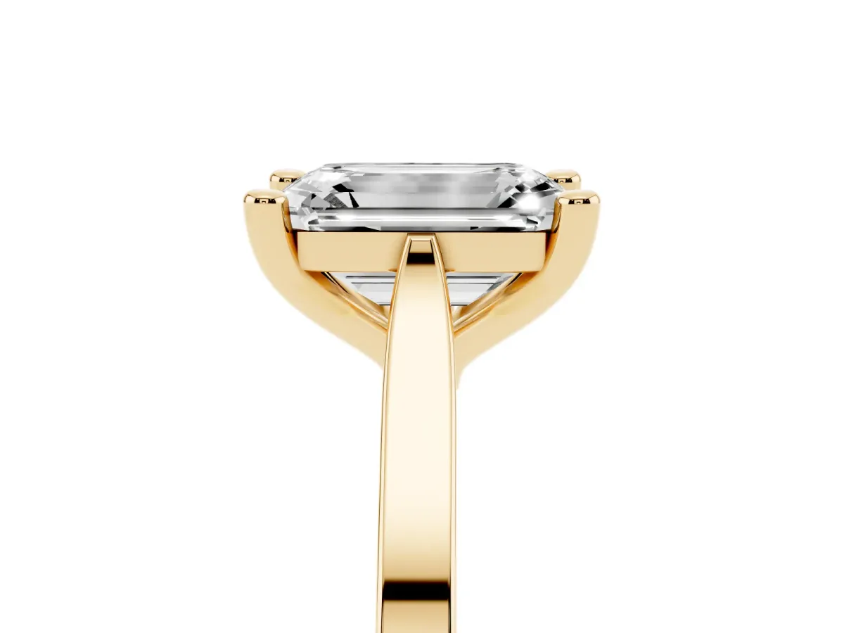 Emerald Cut Solitaire Diamond Ring with Four-Prong Setting and Tapered Band Yellow gold