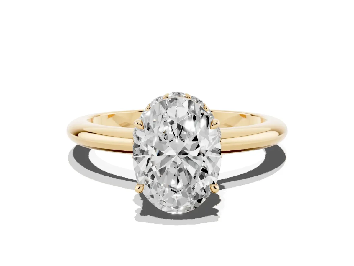 Oval Cut Brilliant Solitaire Engagement Ring with Six-Prong Setting and Classic Band Yellow gold