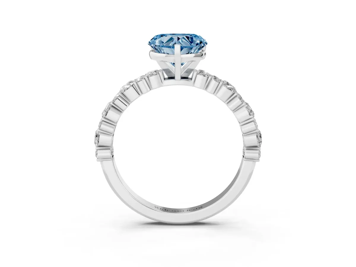 Fancy Blue Heart Cut Diamond Side Stone Solitaire Ring with Round and Four-Prong Setting Silver