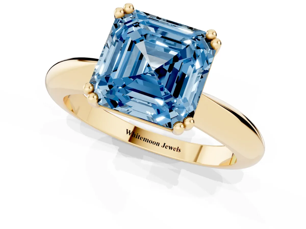Fancy Blue Asscher Cut Cut Solitaire Engagement Ring with Tapered Band and Four-Prong Setting Yellow gold