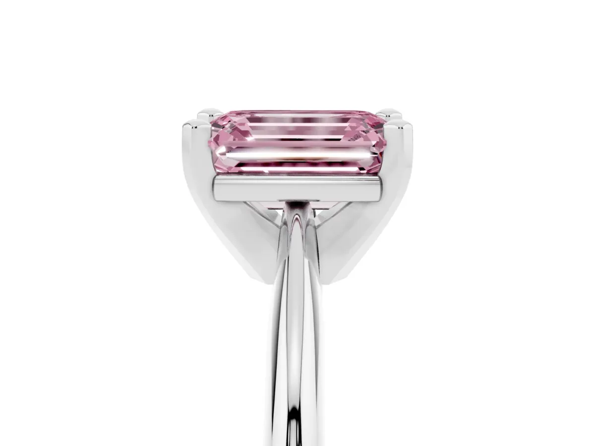 Fancy Pink Emerald Cut Cut Solitaire Ring with Four-Prong Setting on a Classic Band Platinum