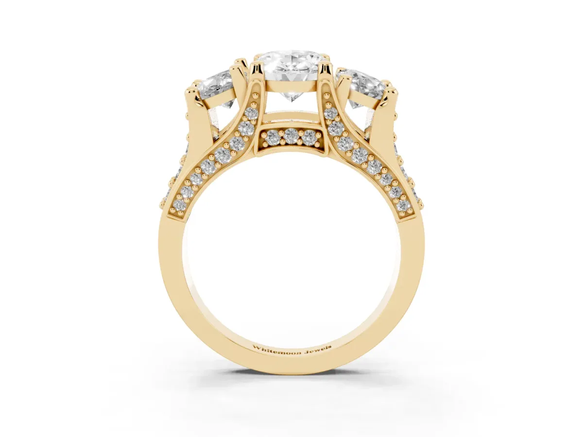 Oval Cut Diamond Three-Stone Ring with Channel Set Band and Four-Prong Setting Yellow gold