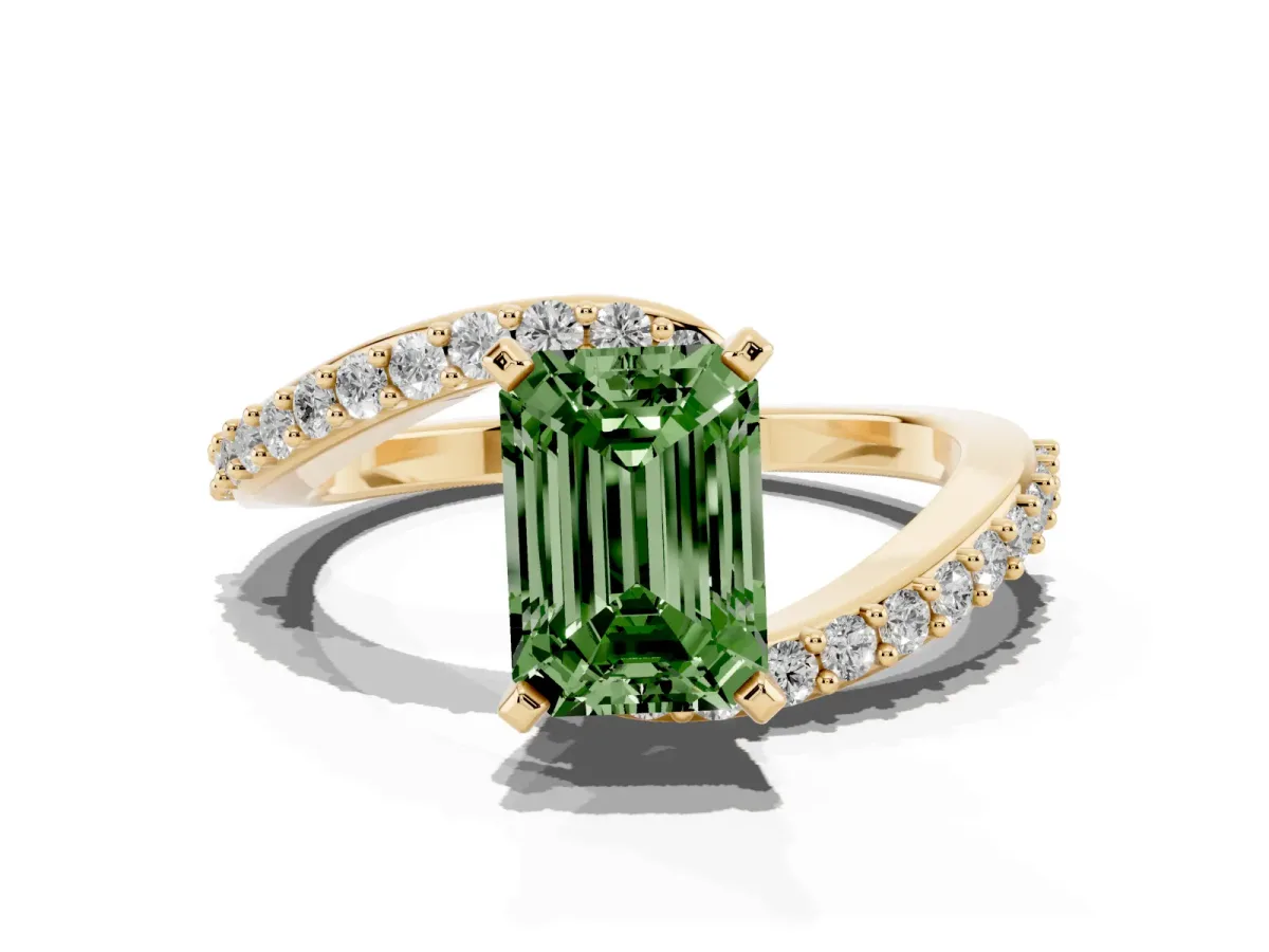 Fancy Green Emerald Cut Solitaire Twist Band with Pave Set Diamonds and Four-Prong Setting Yellow gold