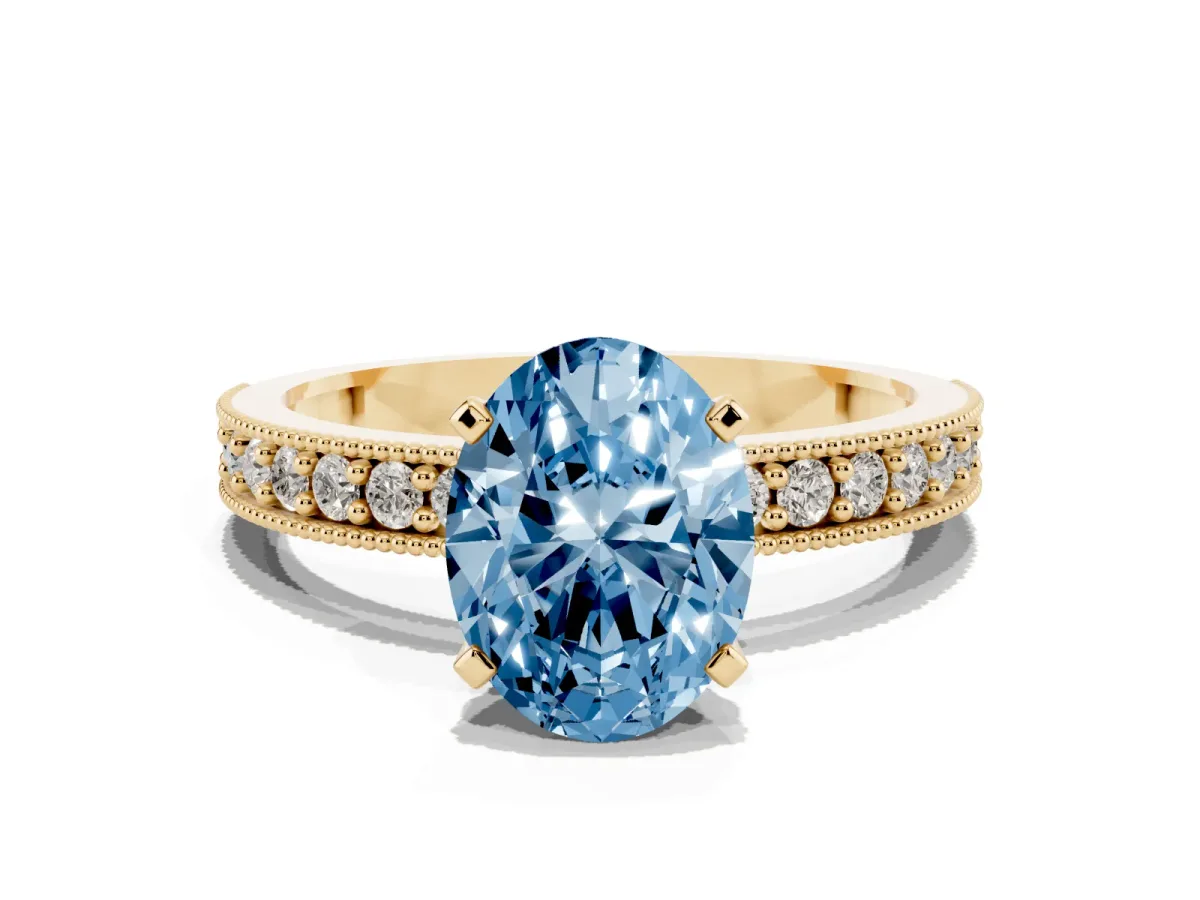 Fancy Blue Oval Cut Diamond Milgrain Pavé Engagement Ring with Four-Prong Setting Yellow gold
