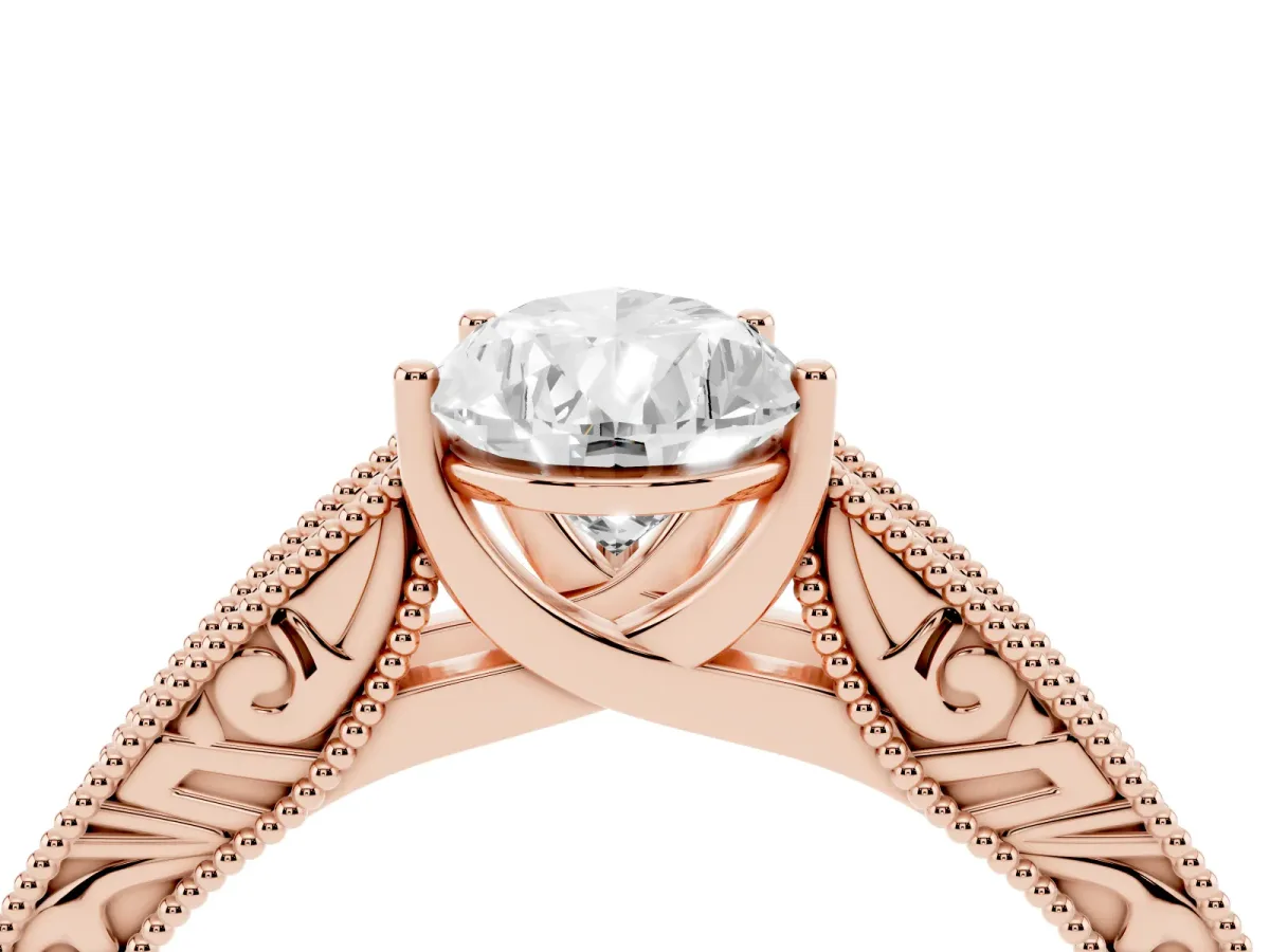 Pear Cut Diamond Solitaire Ring with Engraved Band and Four-Prong Setting Rose gold