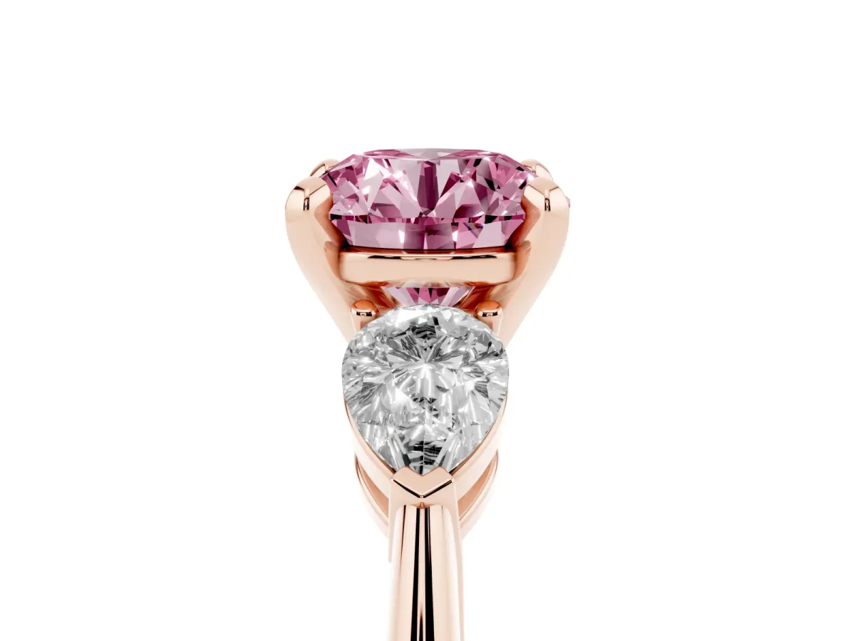 Fancy Pink Three-Stone Round Cut Diamond Ring with Pear Side Stones and Four-Prong Setting Rose gold