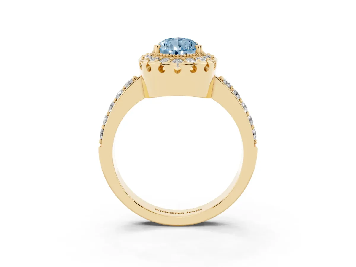 Fancy Blue Pear Cut Diamond Halo Ring with Pavé Band and Prong Setting Yellow gold
