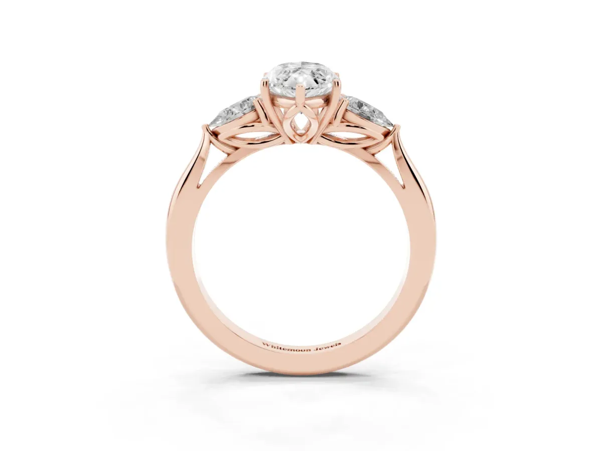 Three-Stone Marquise Cut Diamond Ring with Pear Side Stones in Four-Prong Setting Rose gold