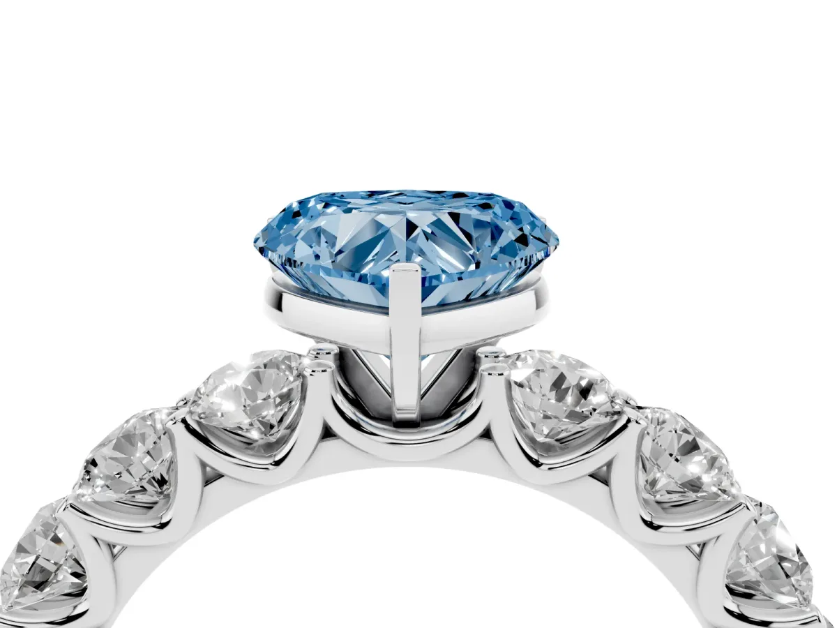 Fancy Blue Heart Cut Diamond Prong Setting with Side Stones on a Pave Band Silver