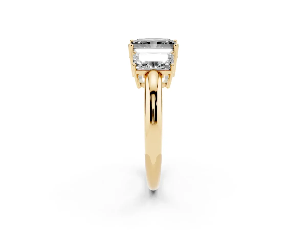 Fancy Black Three-Stone Radiant Cut Cut Diamond Engagement Ring with Prong Setting on a White Gold Band Yellow gold