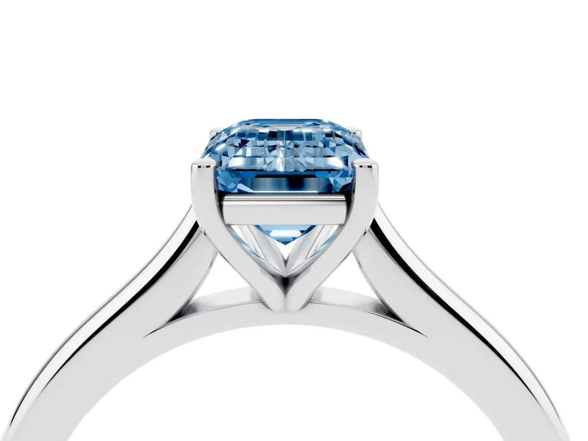 Fancy Blue Emerald Cut Cut Solitaire Ring with Cathedral Band and Four-Prong Setting Silver