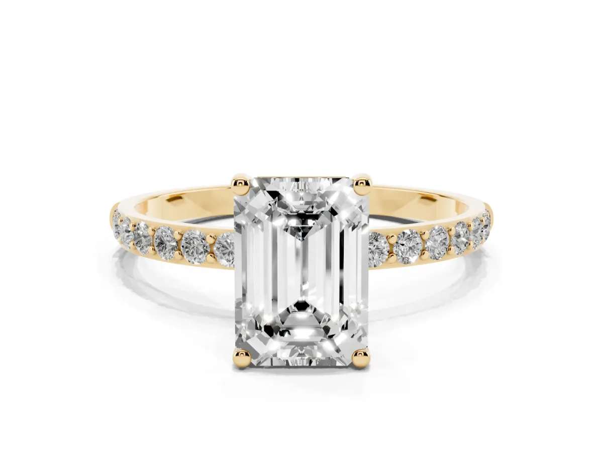 Emerald Cut Diamond Solitaire Ring with Round Pavé Shoulders and Prong Setting Yellow gold
