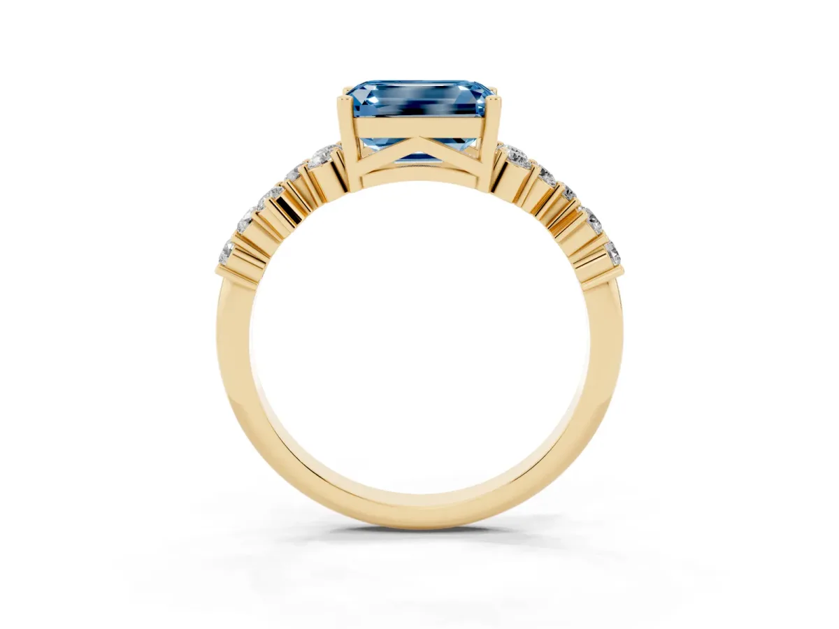 Fancy Blue Emerald Cut Diamond Scattered Round Accent Ring with Prong Setting Yellow gold