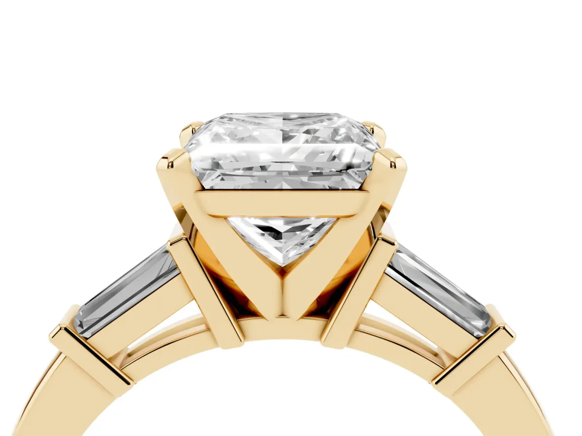 Princess Cut Cut Diamond Solitaire Ring with Tapered Baguette Accents and Four-Prong Setting Yellow gold