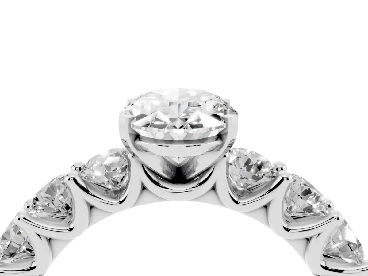 Oval Cut Diamond Prong Setting with Side Stones on a Pave Band Silver