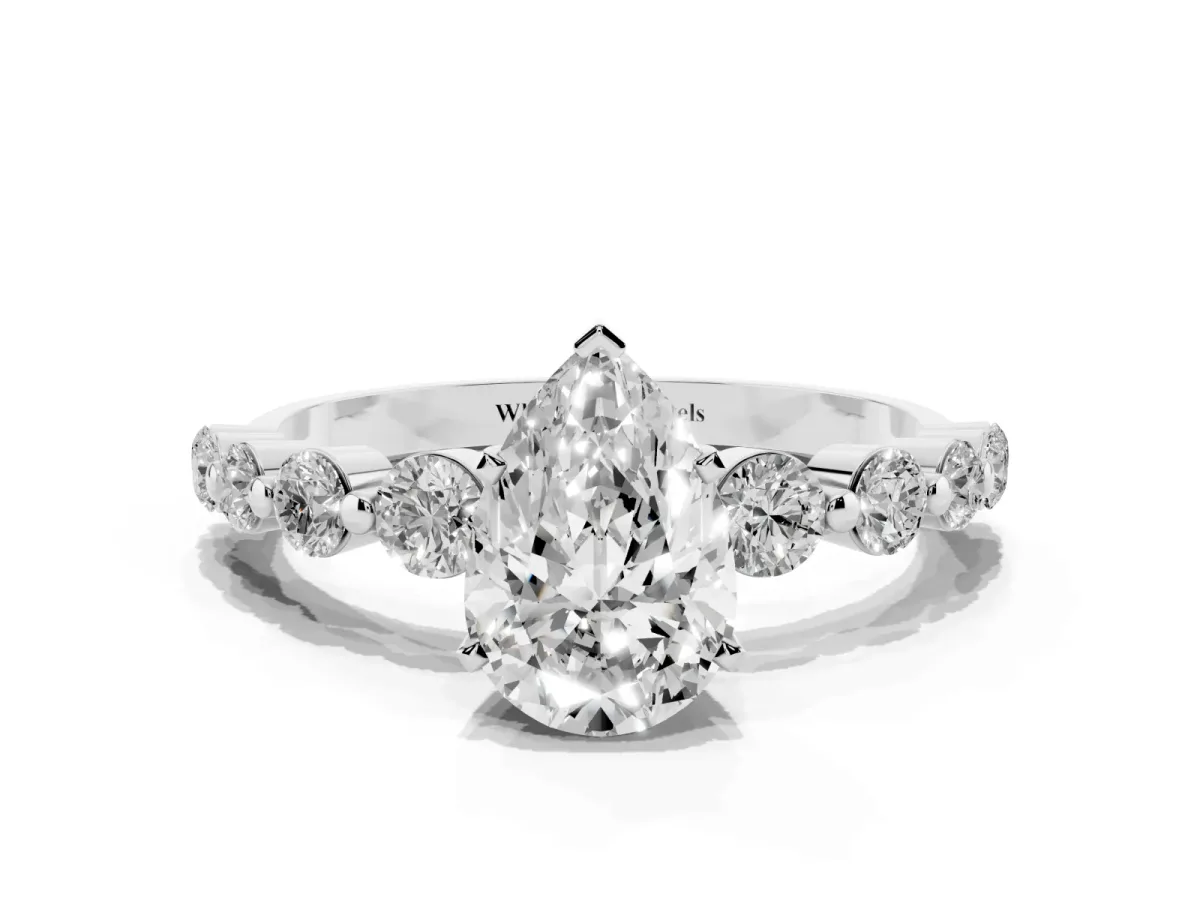 Pear Cut Solitaire Diamond Ring with Pave Band and Four-Prong Setting Silver