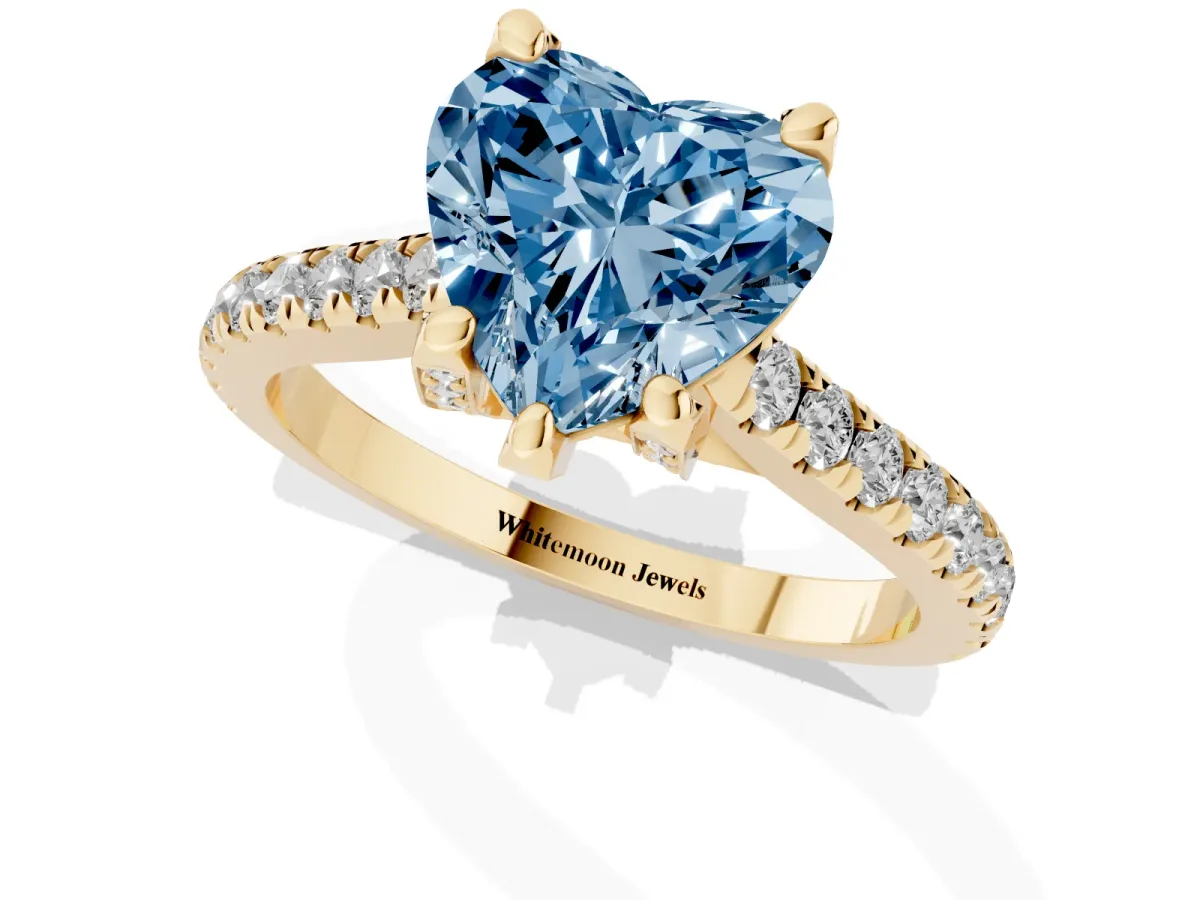 Fancy Blue Heart Cut Brilliant Diamond Solitaire with Pavé Band and Four-Prong Setting Yellow gold