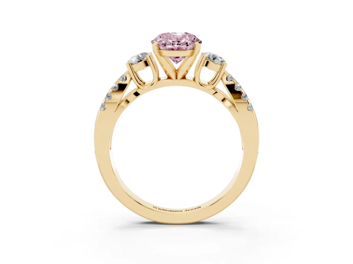 Fancy Pink Oval Cut Diamond Three-Stone Ring with Pavé Split Shank and Four-Prong Setting Yellow gold
