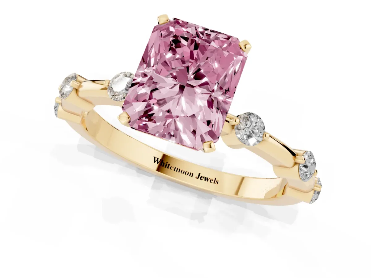 Fancy Pink Radiant Cut Solitaire Diamond Ring with Bezel Set Side Stones and Prong Setting Yellow gold