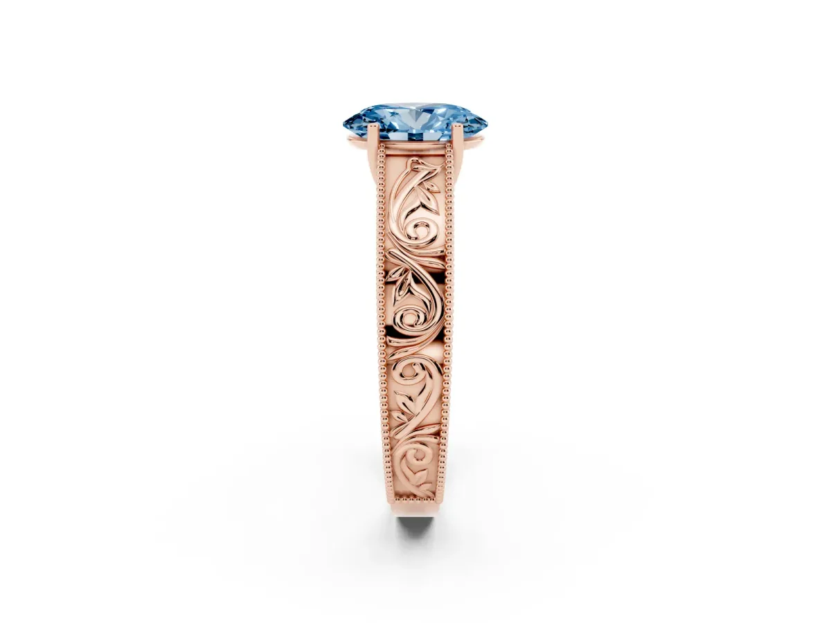 Fancy Blue Oval Cut Diamond Solitaire Ring with Engraved Band and Four-Prong Setting Rose gold