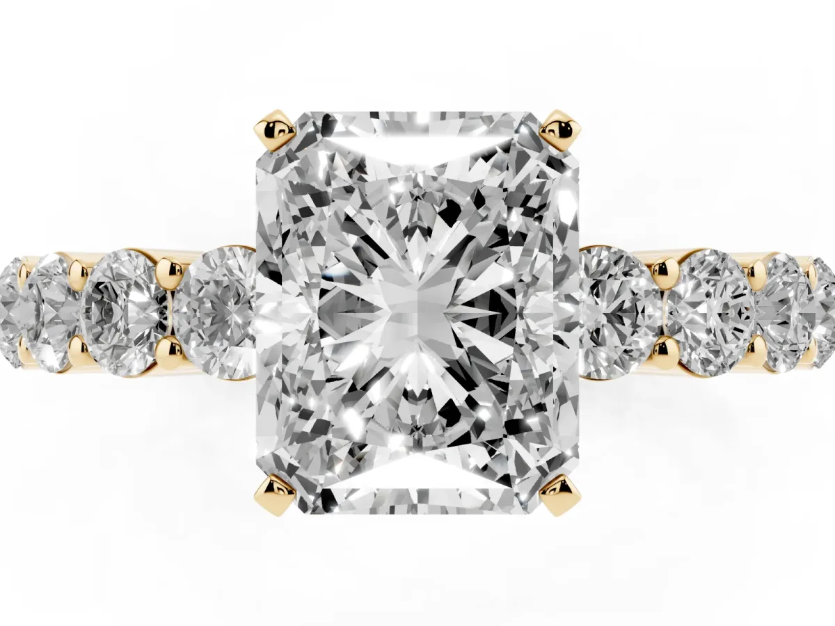 Radiant Cut Diamond Solitaire Ring with Shared Prong Round Side Stones Yellow gold