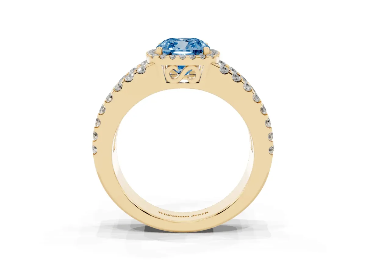 Fancy Blue Cushion Cut Cut Halo Split Shank Diamond Ring with Four-Prong Setting Yellow gold