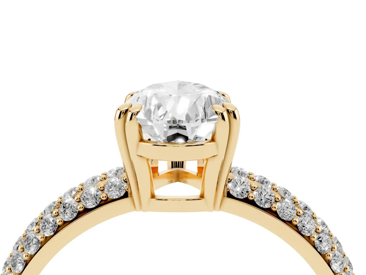 Pear Cut Diamond Solitaire Ring with Multi-Row Round Pavé Band and Prong Setting Yellow gold