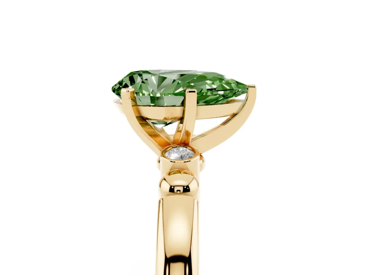 Fancy Green Pear Cut Solitaire Beaded Band with Four-Prong Setting Yellow gold