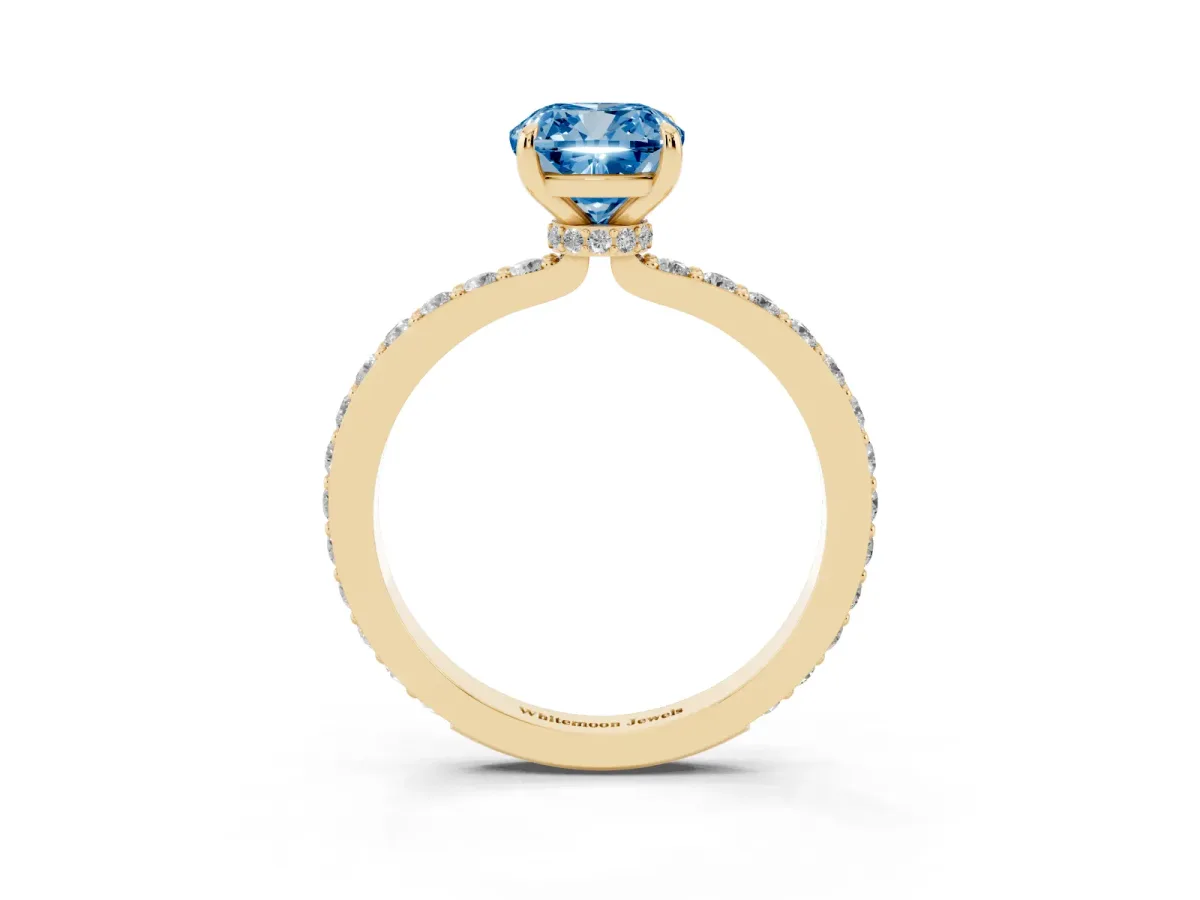 Fancy Blue Cushion Cut Diamond Pavé Engagement Ring with Round Accents and Prong Setting Yellow gold