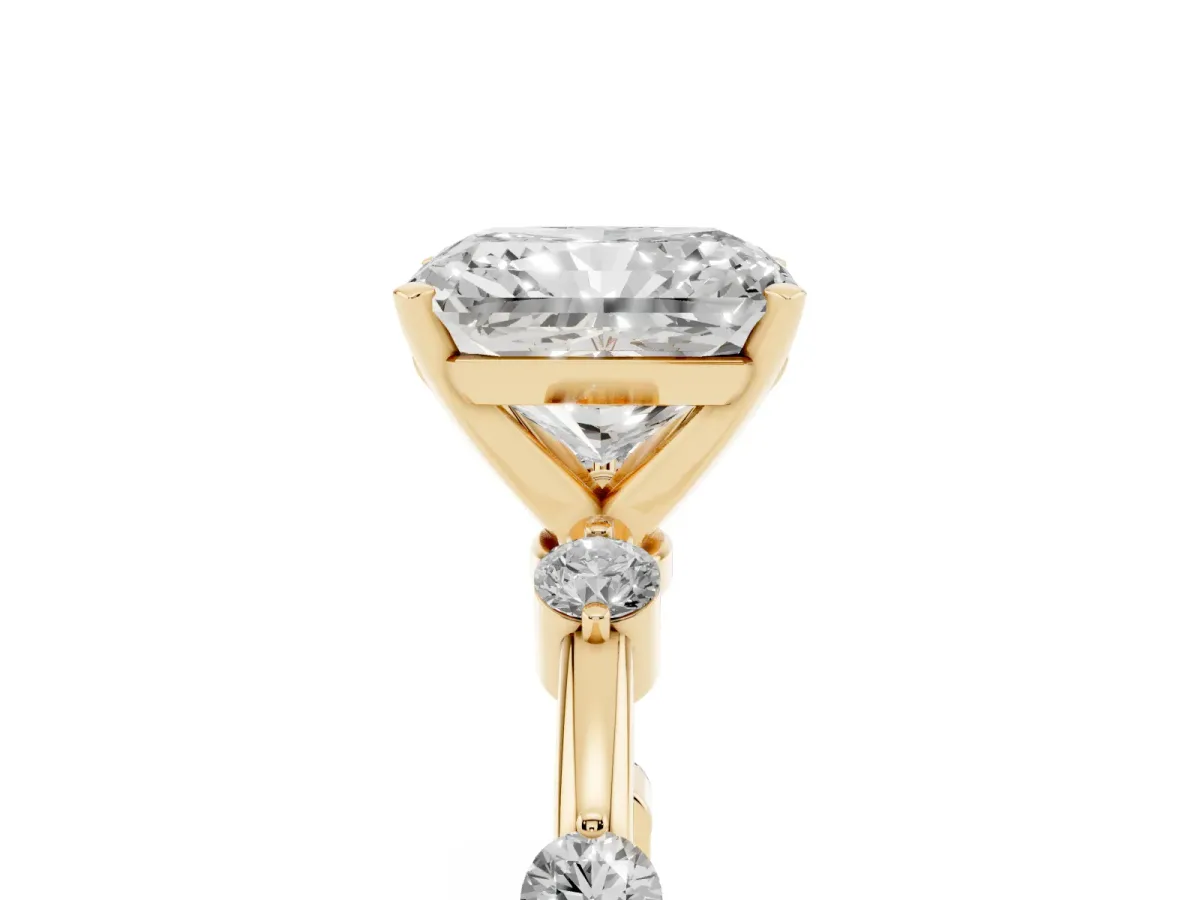 Radiant Cut Solitaire Diamond Ring with Bezel Set Side Stones and Prong Setting Yellow gold