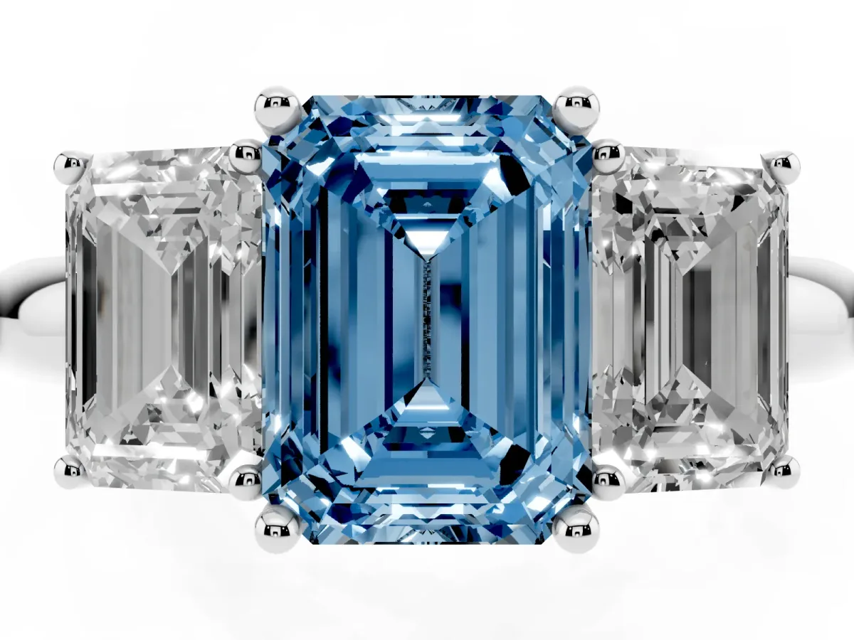 Fancy Blue Three-Stone Emerald Cut Cut Diamond Engagement Ring with Prong Setting on a White Gold Band White gold