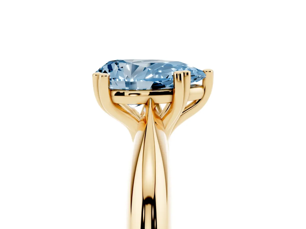 Fancy Blue Pear Cut Cut Solitaire Engagement Ring with Tapered Band and Four-Prong Setting Yellow gold
