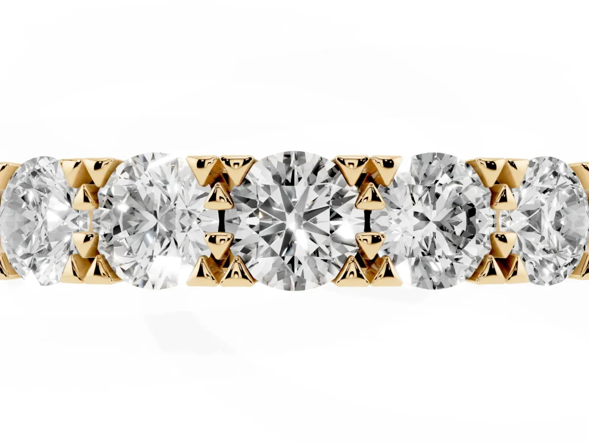 Round Diamond Channel Set Half Eternity Band with Shared Prong Setting Yellow gold