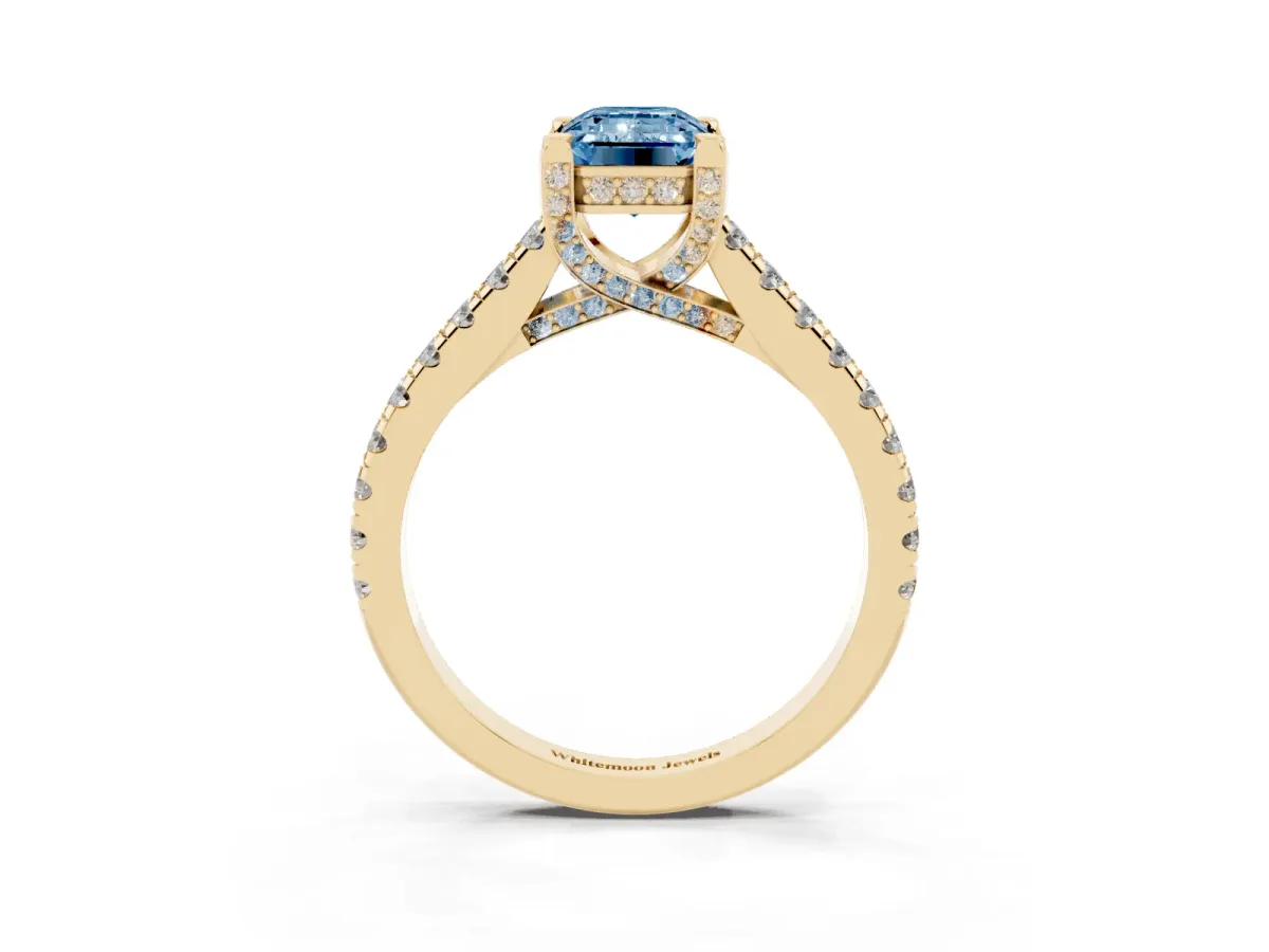 Fancy Blue Emerald Cut Brilliant Diamond Solitaire with Pavé Band and Four-Prong Setting Yellow gold